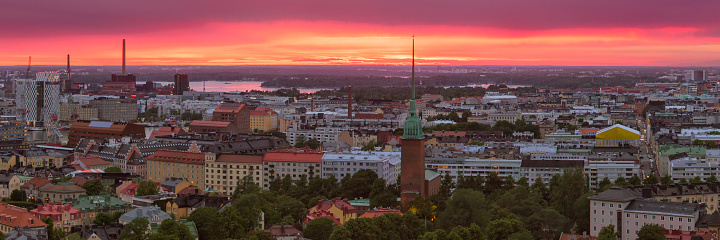 Aerial view of downtown Helsinki at sunset. In the center is the Mikael Agricola Church.