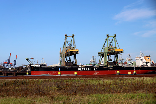 Unloading of a coal bulk ship at the Maasvlakte Harbor as part of the port of Rotterdam