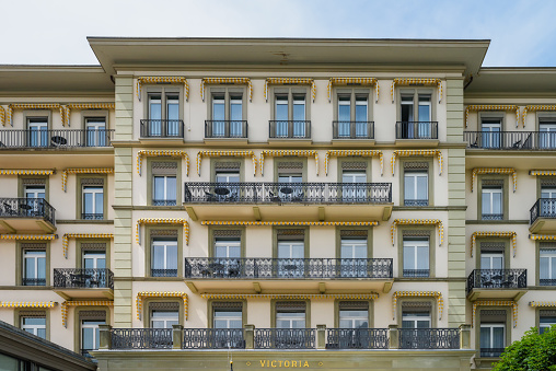 Interlaken, Switzerland - June 20, 2023: Hotel facade Victoria - Five star Grand Hotel and Spa in Interlaken, Switzerland