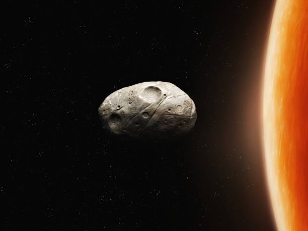 istock Phobos is a satellite of Mars. Red planet moon in space isolated. 1794569276