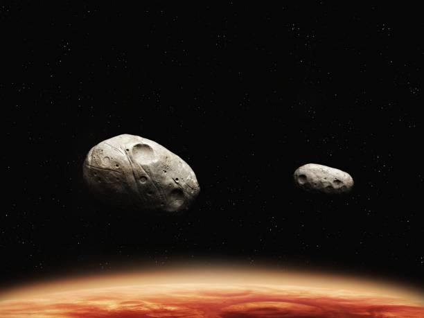 istock Phobos and Deimos, moons of the red planet. 1794574184