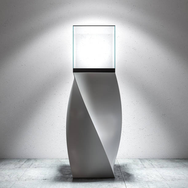 glass theca with pedestal on concrete ground.