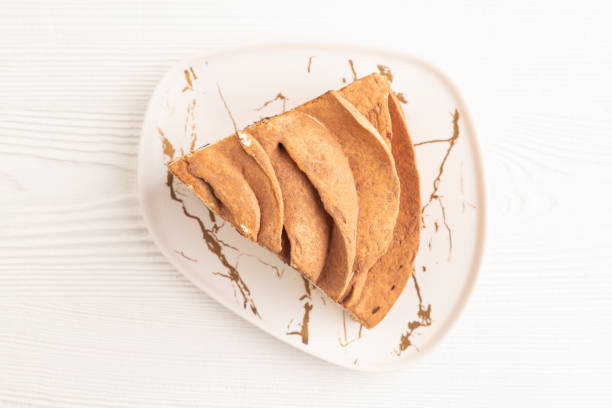 istock Marshmallow cake on white wooden. top view 1794595639