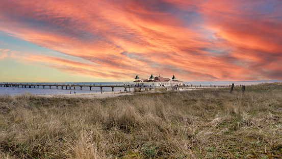 Pier and beach in Ahlbeck on the Baltic Sea on Usedom at sunset