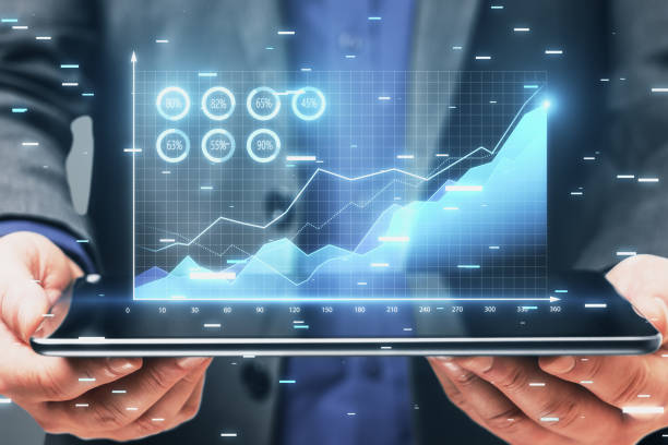 Businessman analyzing digital growth chart on a tablet