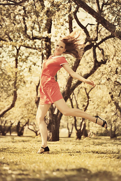 istock Beautiful young woman running in park 179462906