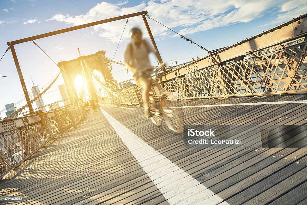 Cyclyst on Broklyn Bridge in New York Ciclyst on Brooklyn Bridge in New York at dusk. Brooklyn Bridge Stock Photo