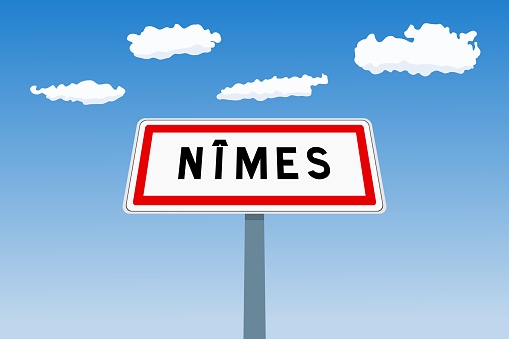Nimes city sign in France. City limit welcome road sign.
