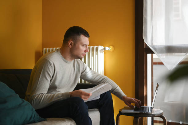 istock Handsome man working on laptop outdoors. 1794640857