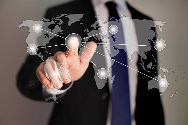 istock A man touching a screen that is connecting dots on the globe 179464572