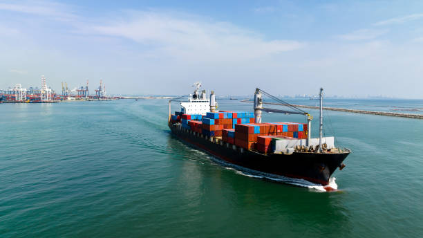 istock cargo container shipping sailing in sea import export logistic goods and distributing products to dealer and consumers across worldwide, by container ship Transport, business service. 1794649460