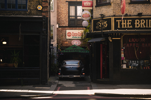 September 17, 2022: A matte black vintage hot rod car on a street in central London