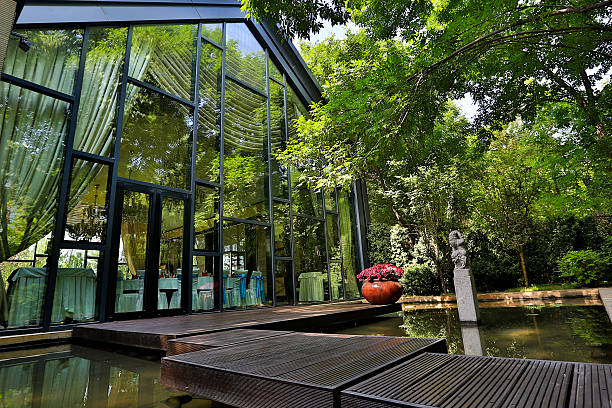 istock Glass House with pond and a patio 179465616