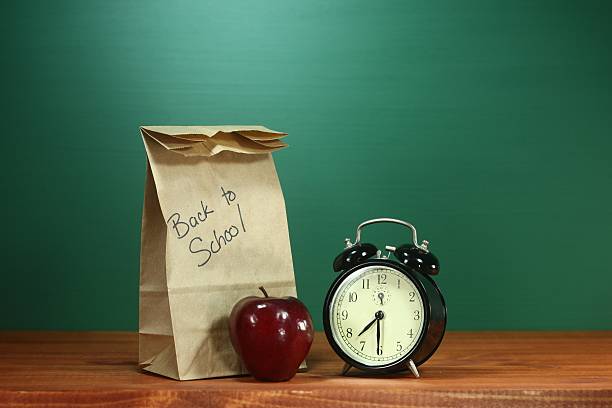 istock Paper Back to School Lunch, Apple and Clock on Desk 179465805