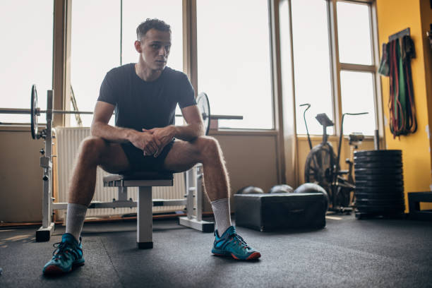 istock Man sitting in gym 1794666154