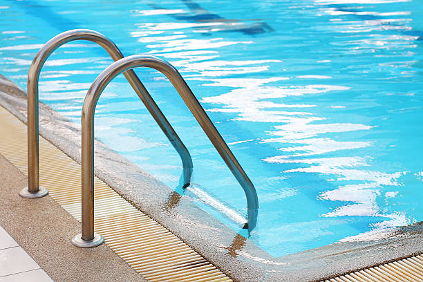 istock railing stairs down to the pool with fresh water 179466686