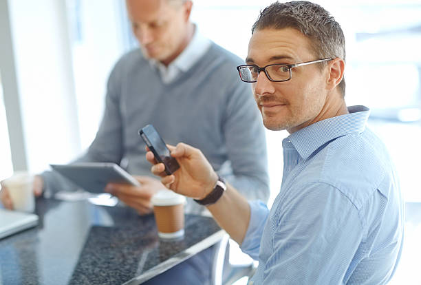 istock Texting the office to say his meeting is running late 179466946
