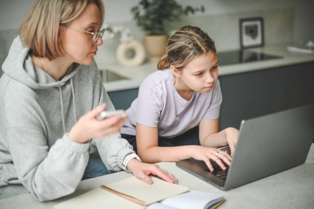 istock mother and daughter doing homework 1794672352