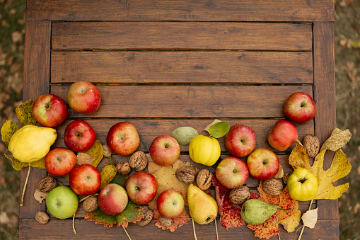autumn flat lay with apples, pears, leaves and eco bag.