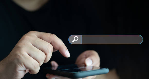 istock Man holding smartphone or mobile phone for searching data information networking. 1794679312