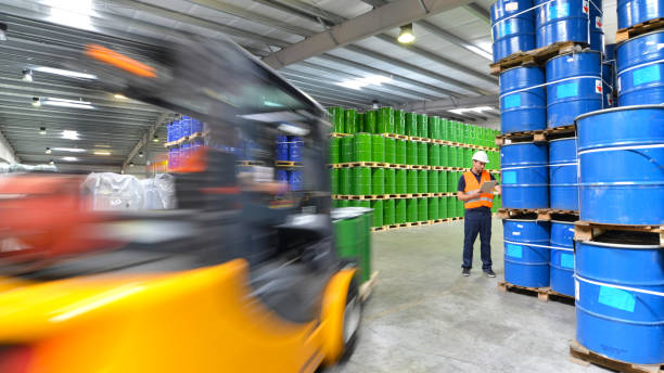 istock group of workers in the logistics industry work in a warehouse with chemicals 1794684145