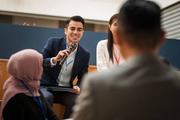 istock Crossing Perspectives: A Multiracial Business Seminar's Interactive Q&A in a Modern Office Setting 1794691390