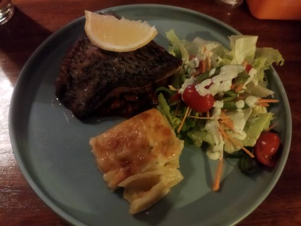 istock Steak with potato gratin and salad 1794691945