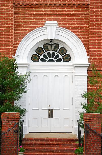 istock White Church Doors with Arch and Brick Stairway 179469727