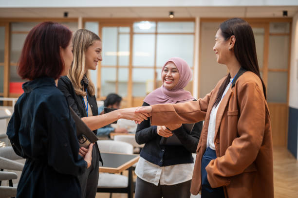 istock Empowered Exchange: Multiracial Businesswomen Engage in Progressive Office Dialogue 1794700214