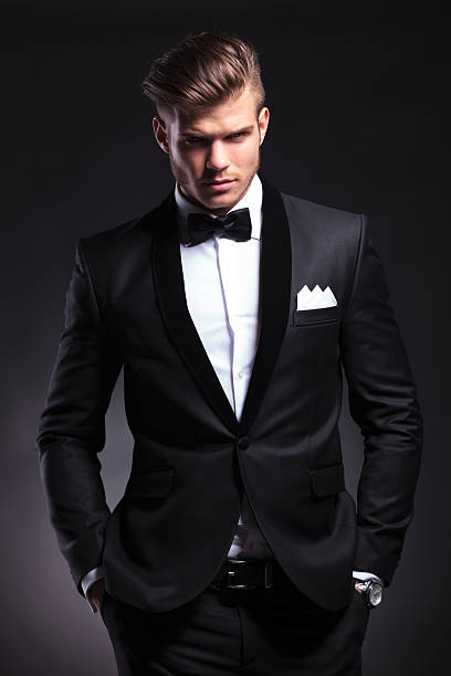istock business man holds both hands in pockets 179470433