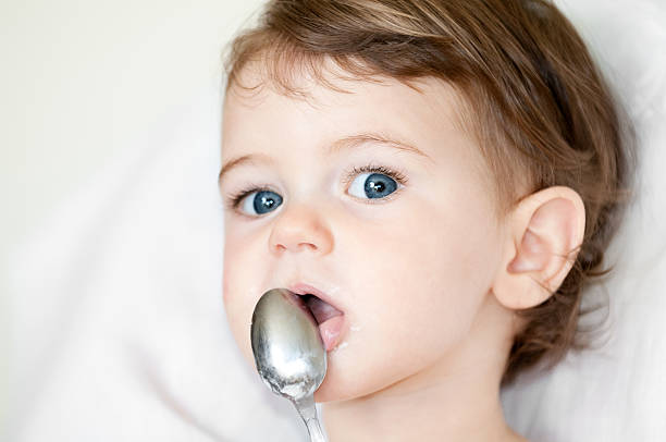 istock Baby Girl Eating Yogurt 179470534