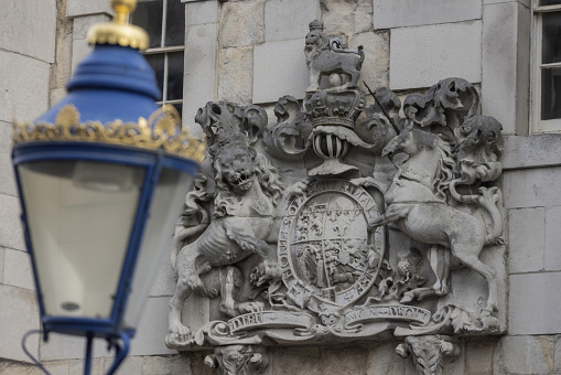 royal coat of arms above the entrance to the middle tower of the Tower of London; London, United Kingdom