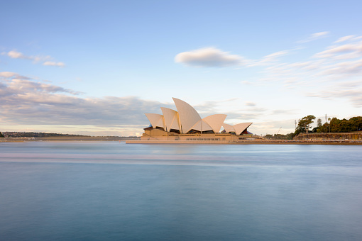 Sydney Australia - July 21, 2023: A bright afternoon in Sydney, New South Wales, and this is the view looking across the Harbour towards the iconic shape of the city's Opera House.