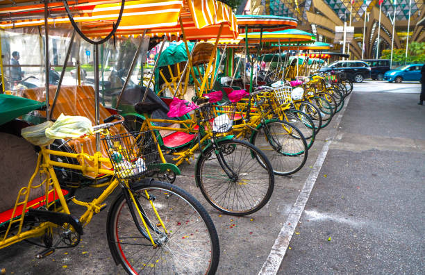 istock raditional Tricolor Rickshaw Parked on a Street in Macau, China 1794732154
