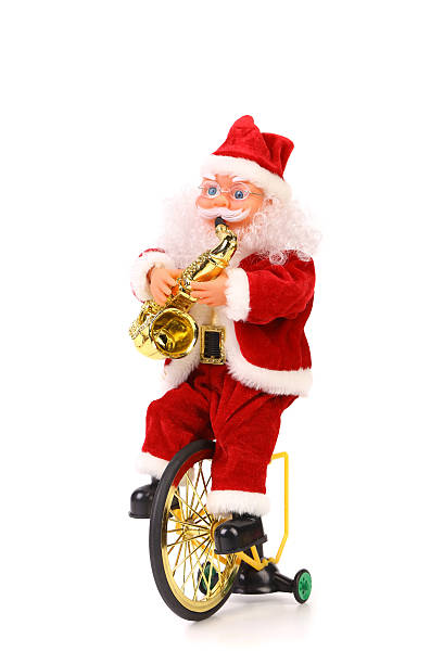 istock Santa Claus plays the saxophone on bicycle 179473838