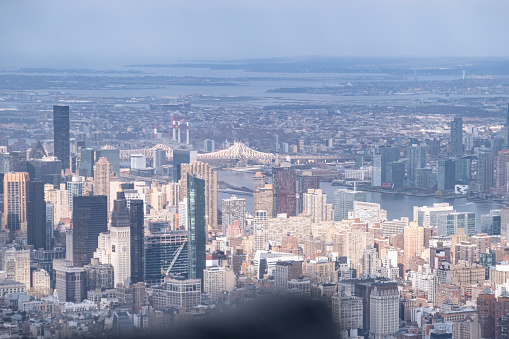 Experience the awe-inspiring aerial view of Manhattan during a helicopter flight. This striking image captures the iconic skyline, showcasing the architectural marvels and bustling energy of New York City from a unique perspective. Perfect for conveying the dynamic spirit of the city that never sleeps