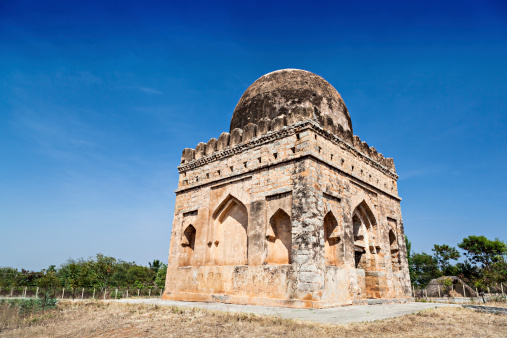 Ruined muslim tomb on the blue sky