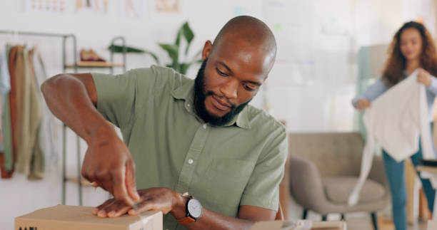 istock Startup business, delivery box or black man with clothes package for export or ecommerce shipping. Dropshipping, fashion product or African entrepreneur supply chain distribution for cargo or courier 1794752116