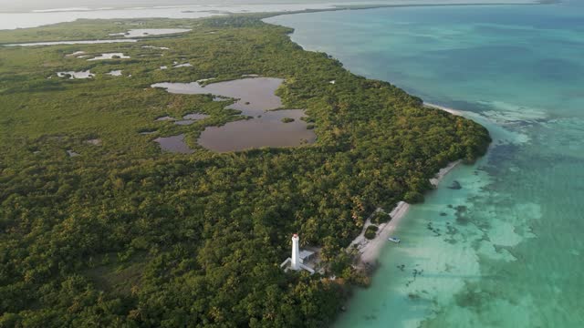 drone fly above natural park biosphere reserve in Tulum Sian Ka'an aerial high angle of punta Allen lighthouse