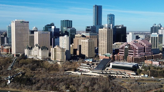 An aerial view of a bustling metropolitan cityscape featuring a skyline of towering skyscrapers