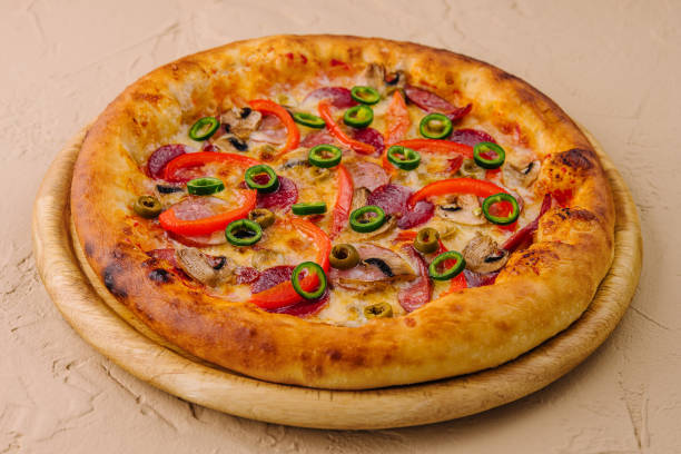 istock Italian pizza on wooden board 1794759820
