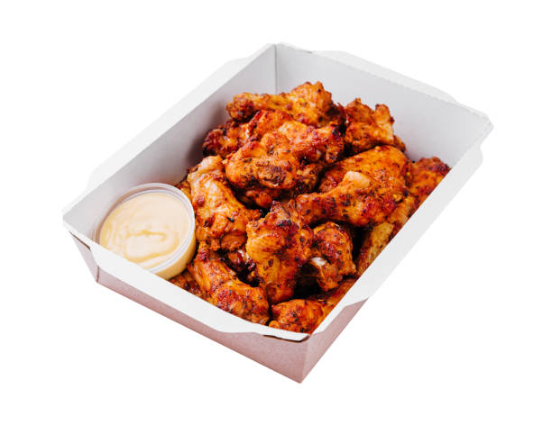 istock Fried chicken wings and legs in a paper box 1794761022