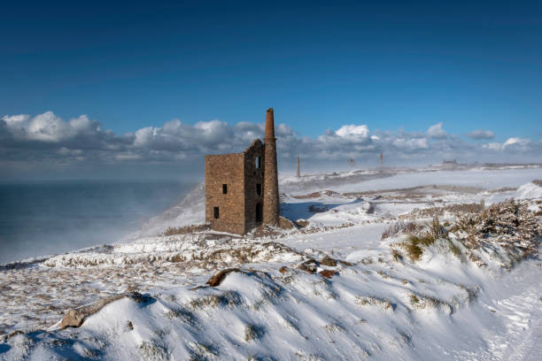 istock Seaside snow and old mine buildings in sunshine 1794767488