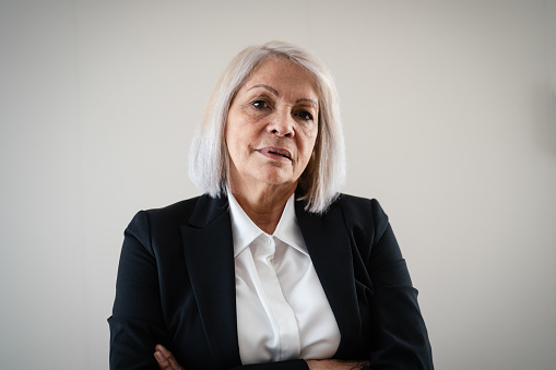 Senior business woman looking in camera