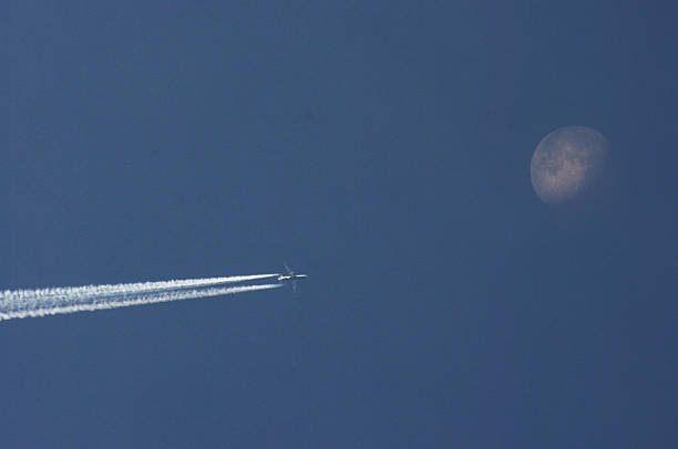 istock Airplane crossing the moon 179477097