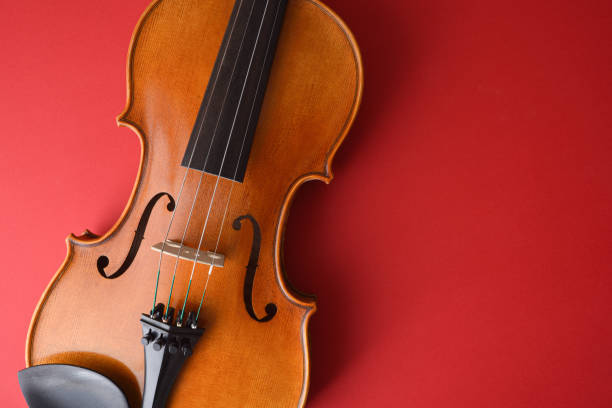 istock Embroidered traditional violin body on isolated gradient romantic red background. 1794772520