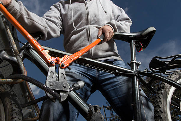 Bike Theft A royalty free image from sports and recreation of a bike theft in progress. thief stock pictures, royalty-free photos & images