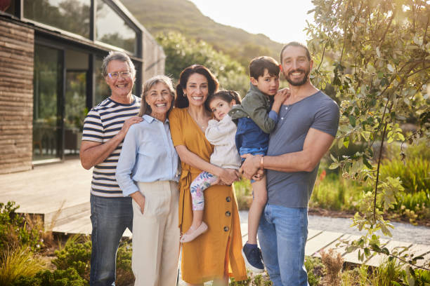 istock Smiling multi-generation family standing together outside in summer 1794814438