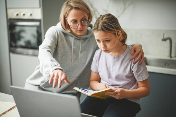 istock mother and daughter doing homework 1794823362