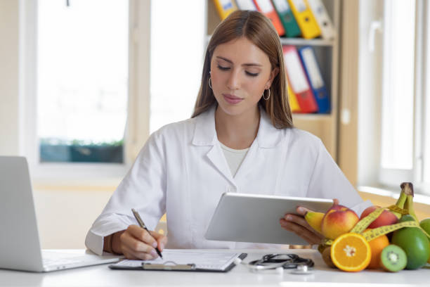 istock Nutritionist uses a digital tablet 1794856317